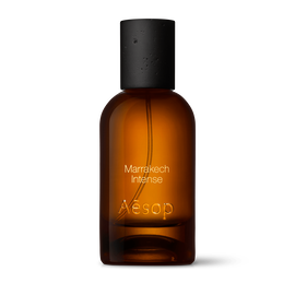 Amber glass Aesop Marrakech Intense Eau de Parfum bottle with black cap on a white background.